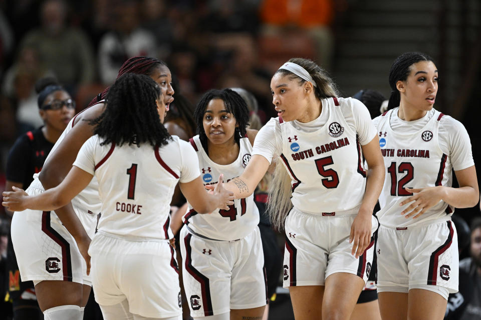 The South Carolina Gamecocks huddle up during a break in play during the Elite Eight round of the NCAA women&#39;s tournament. They face Iowa in the Final Four on Friday. (Grant Halverson/NCAA Photos via Getty Images)