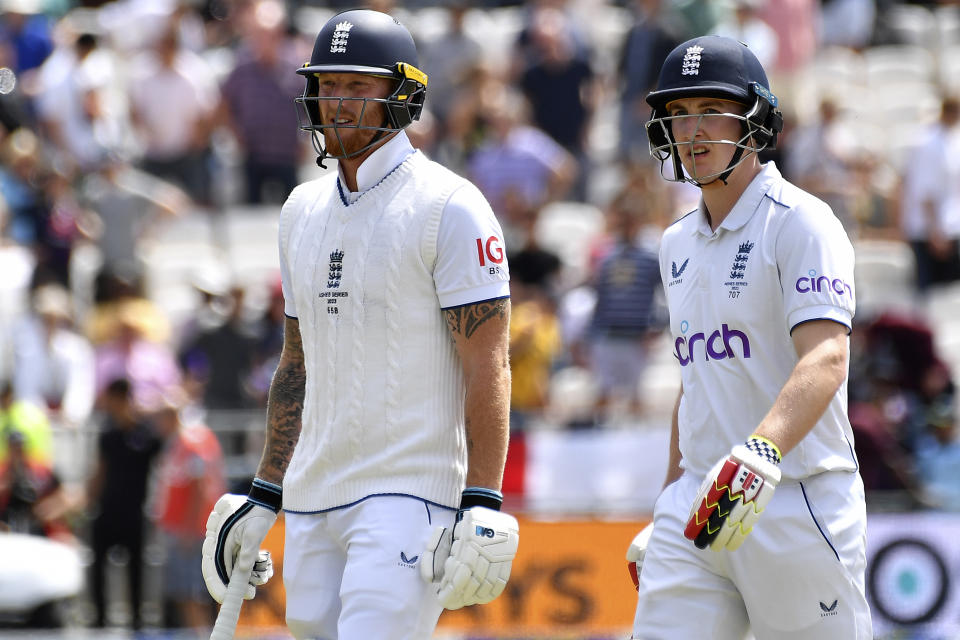 England's Harry Brook, right, and England's Ben Stokes leave the pitch for lunch break during the fourth day of the third Ashes Test match between England and Australia at Headingley, Leeds, England, Sunday, July 9, 2023. (AP Photo/Rui Vieira)