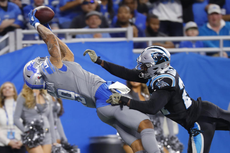 Detroit Lions wide receiver Kenny Golladay (19), defended by Carolina Panthers cornerback James Bradberry (24), catches a 19-yard pass for a touchdown during the second half of an NFL football game, Sunday, Nov. 18, 2018, in Detroit. (AP Photo/Paul Sancya)