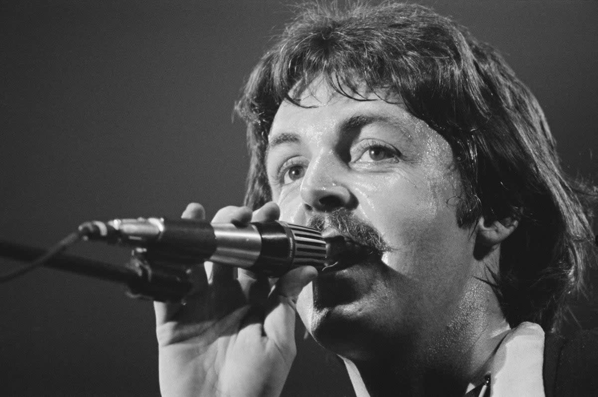Paul McCartney (pictured in 1976) was convinced to keep the lyric by his bandmate, John Lennon (Getty Images)