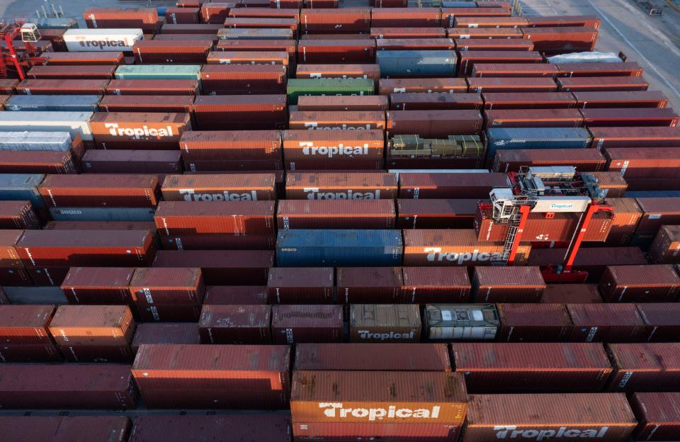 Tropical contains are picked up to be loaded at the Port of Palm Beach March 1, 2023 in Riviera Beach.