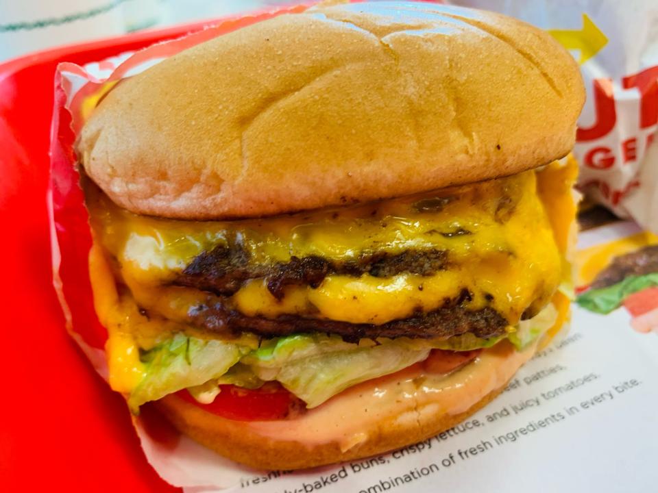 In-n-out double double in red parchment wrapping in a red tray