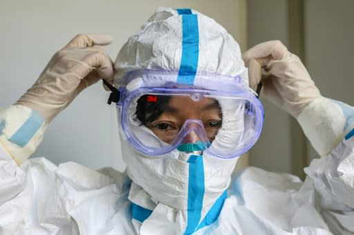 A doctor prepares to enter the isolation ward at a hospital in Wuhan, epicentre of the virus outbreak