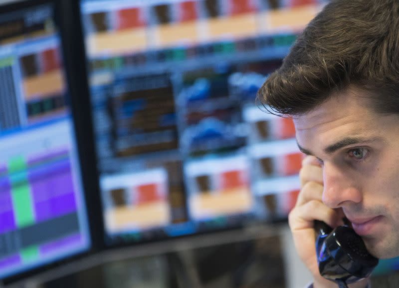 FILE PHOTO: Trader at the trading floor of KBC bank gives a phone call in Brussels