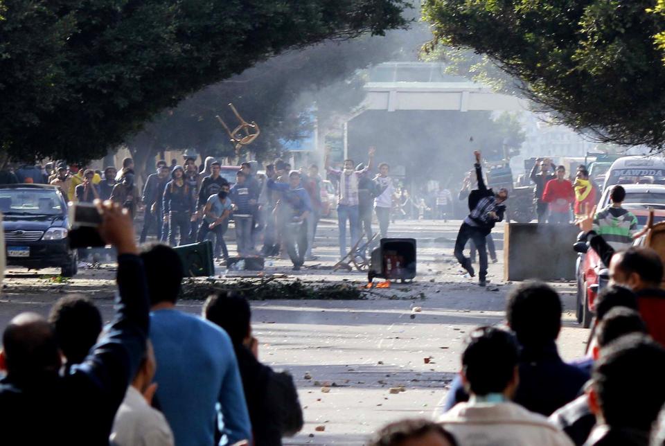 Supporters and opponents of ousted Egyptian President Mohamed Mursi clash at the main university in Alexandria, January 23, 2014. (REUTERS/Al Youm Al Saabi Newspaper)