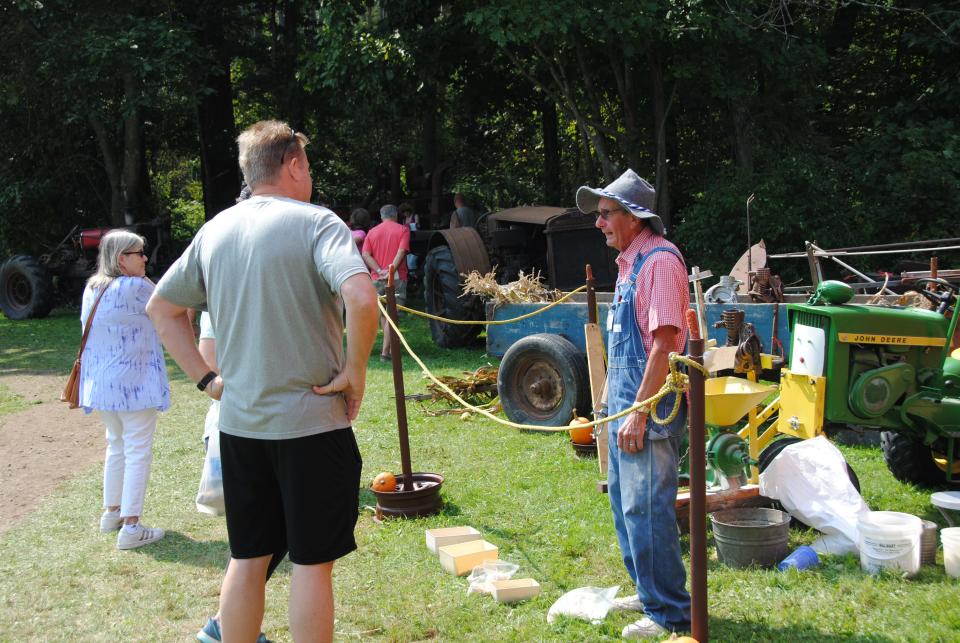 Demonstrators explain their craft to visitors at Mountain Craft Days at the Somerset Historical Center.