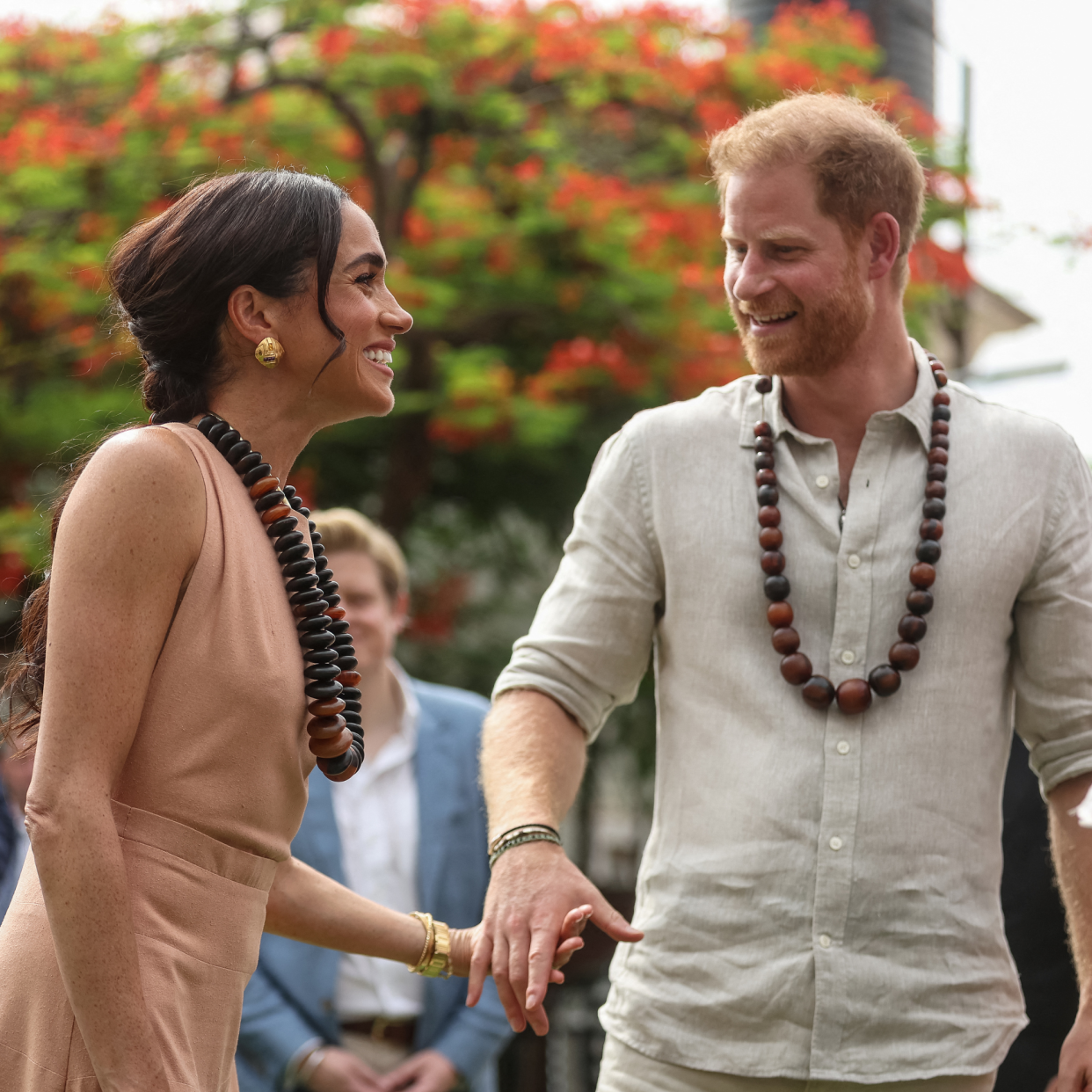  Britain's Prince Harry (R), Duke of Sussex, and Britain's Meghan (L), Duchess of Sussex, arrive at the Lightway Academy in Abuja on May 10, 2024 as they visit Nigeria as part of celebrations of Invictus Games anniversary. 