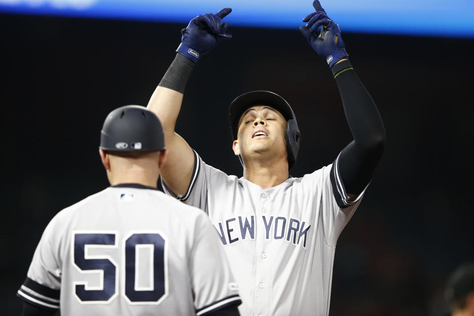 ANAHEIM, CALIFORNIA - APRIL 22:  Gio Urshela #29 of the New York Yankees reacts at first base after an RBI single during the 14th inning of a game against the Los Angeles Angels of Anaheim at Angel Stadium of Anaheim on April 22, 2019 in Anaheim, California.  (Photo by Sean M. Haffey/Getty Images)