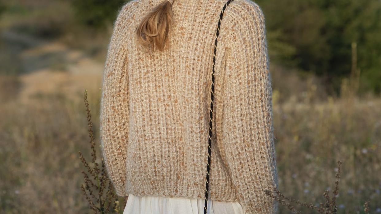 close up of a woman wearing handmade wool sweater