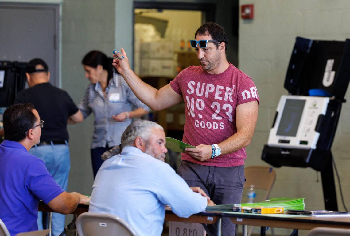 Poll workers assist voters on Election Day at the Miami Beach Fire Department - Station 4 on Tuesday, Nov. 8, 2022, in Miami Beach, Florida.