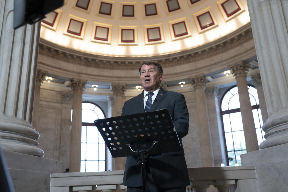 Sen. Mike Rounds, R-S.D., does a television news interview before joining Senate Majority Leader Chuck Schumer, D, N.Y., to convene a closed-door gathering of leading tech CEOs to discuss the priorities and risks surrounding artificial intelligence and how it should be regulated, at the Capitol in Washington, Wednesday, Sept. 13, 2023. (AP Photo/J. Scott Applewhite)