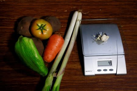 Vegetables lie next to coca paste worth $8,000 Colombian pesos at a local store in Guyabero Region, Guaviare, Colombia, May 24, 2016. REUTERS/John Vizcaino