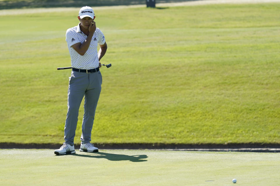 Coilin Morikawa reacts after missing a birdie putt on the 18th hole during the final round of the Charles Schwab Challenge golf tournament at the Colonial Country Club in Fort Worth, Texas, Sunday, June 14, 2020. (AP Photo/David J. Phillip)