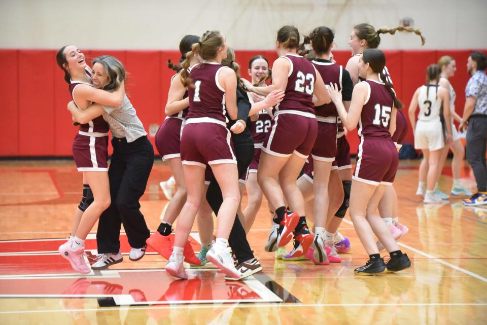Morenci celebrates after Wednesday's Division 4 regional final win against Allen Park Inter-City Baptist at Whitmore Lake.