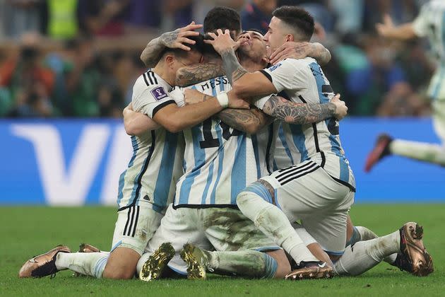 Argentina's forward Lionel Messi (center) celebrates with teammates after they won the Qatar 2022 World Cup final match between Argentina and France at Lusail Stadium in on Dec. 18.