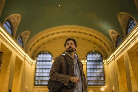 Australian freelance photojournalist Daniel Berehulak poses for a portrait in Grand Central Terminal in Midtown, New York on April 20, 2015. REUTERS/Adrees Latif