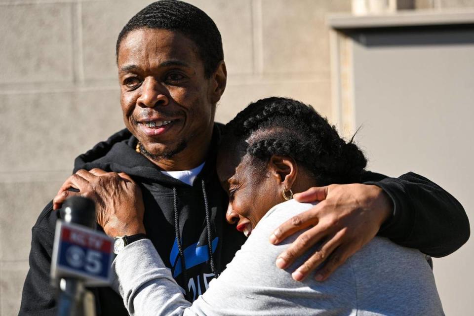 Eve Moffatt hugs her son, Keith Carnes, before he spoke to the press outside of his attorneys office Monday, April 11, 2022. Earlier in the day, Carnes was freed from prison after 18 years. The prosecutors office declined to file charges after the Missouri Supreme Court threw out his conviction for murder and armed criminal action.