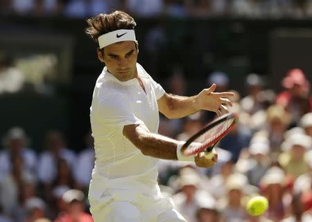 Roger Federer of Switzerland hits a shot during his match against Damir Dzumhur of Bosnia and Herzegovina at the Wimbledon Tennis Championships in London, June 30, 2015. REUTERS/Henry Browne