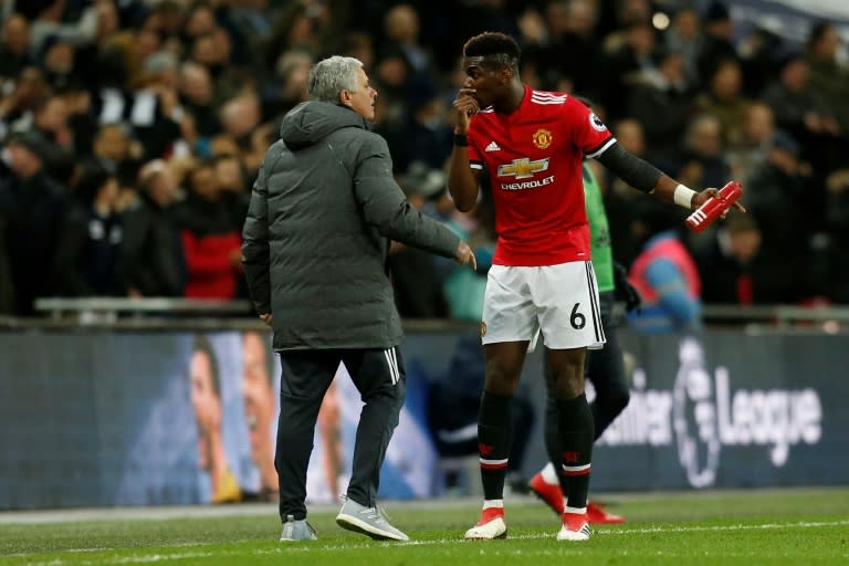 Manchester United's manager Jose Mourinho (L) talks with midfielder Paul Pogba on the sidelines in January 2018