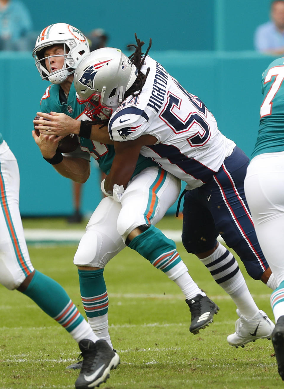 New England Patriots outside linebacker Dont'a Hightower (54) tackles Miami Dolphins quarterback Ryan Tannehill (17), during the first half of an NFL football game, Sunday, Dec. 9, 2018, in Miami Gardens, Fla. (AP Photo/Wilfredo Lee)