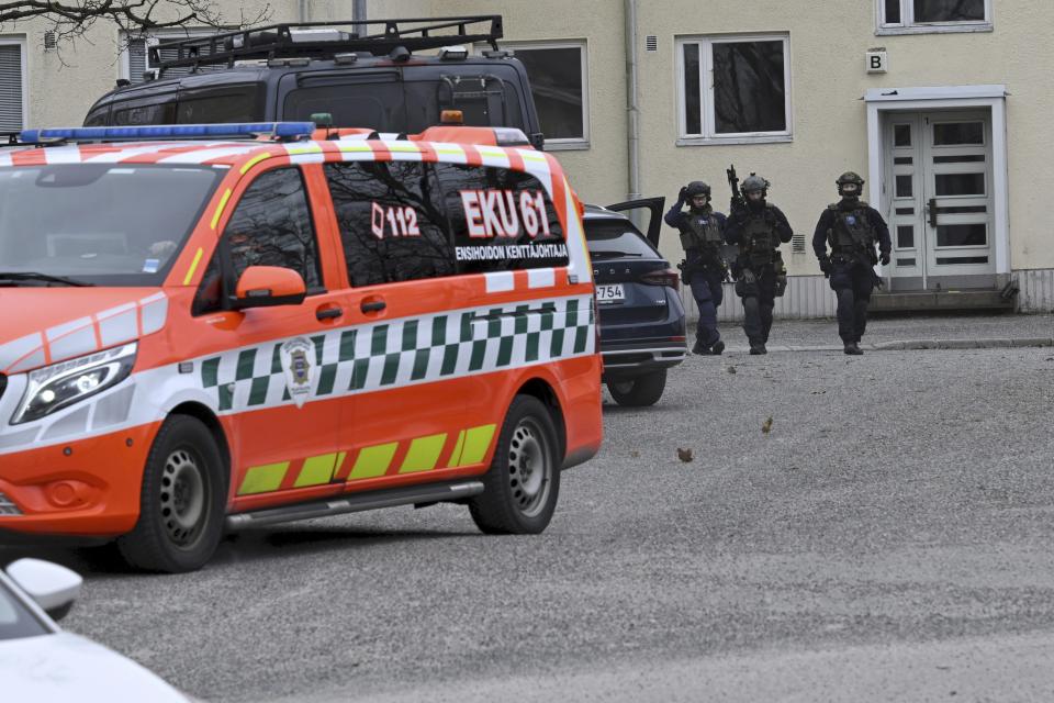 Police officers at the scene of Viertola comprehensive school, in Vantaa, Finland, Tuesday, April 2, 2024. Finnish police say a number of people were wounded in a shooting at a school outside Helsinki and a suspect was detained. (Markku Ulander/Lehtikuva via AP)