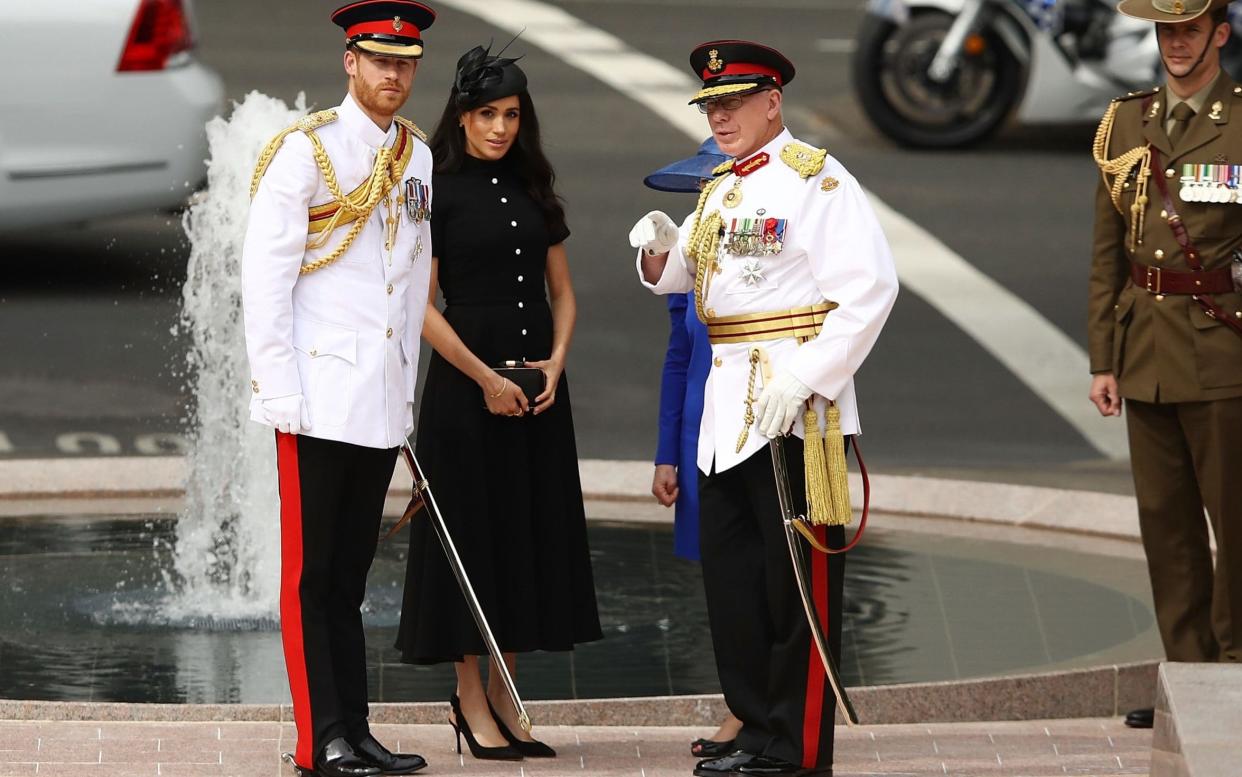 Prince Harry, Duke of Sussex and Meghan, Duchess of Sussex unveil the Anzac memorial with David Hurley, the governor of New South Wales  - Getty Images AsiaPac