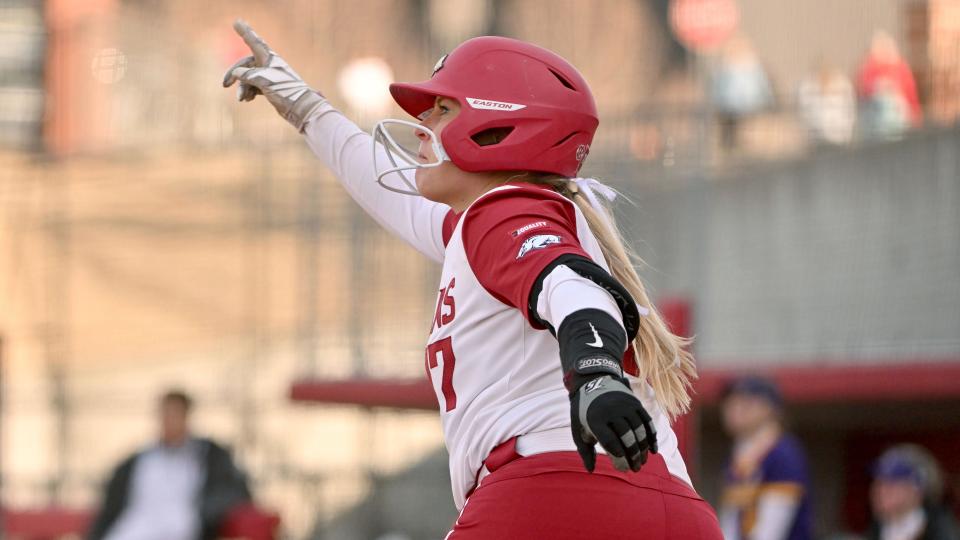 Arkansas batter Taylor Ellsworth (17) reacts after hitting against Western Illinois during an NCAA softball game on Sunday, Feb. 20, 2022, in Fayetteville, Ark. (AP Photo/Michael Woods)