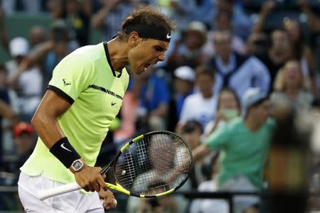 Mar 26, 2017; Miami, FL, USA; Rafael Nadal of Spain celebrates after winning match point against Philip Kohlschreiber of Germany (not pictured) on day six of the 2017 Miami Open at Crandon Park Tennis Center. Nadal won 0-6, 6-2, 6-3. Mandatory Credit: Geoff Burke-USA TODAY Sports