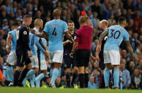 Soccer Football - Premier League - Manchester City vs Everton - Manchester, Britain - August 21, 2017 Everton's Morgan Schneiderlin is shown a red card by referee Robert Madley after receiving a second yellow card REUTERS/Phil Noble