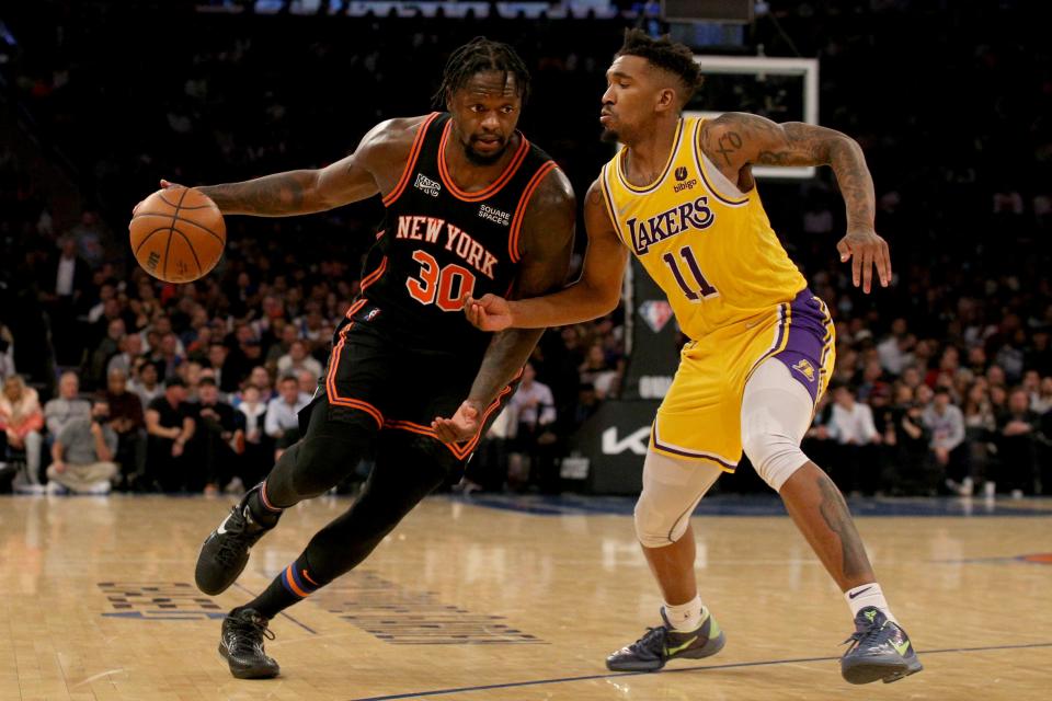 New York Knicks forward Julius Randle (30) drives to the basket against Los Angeles Lakers guard Malik Monk (11) during the third quarter at Madison Square Garden.