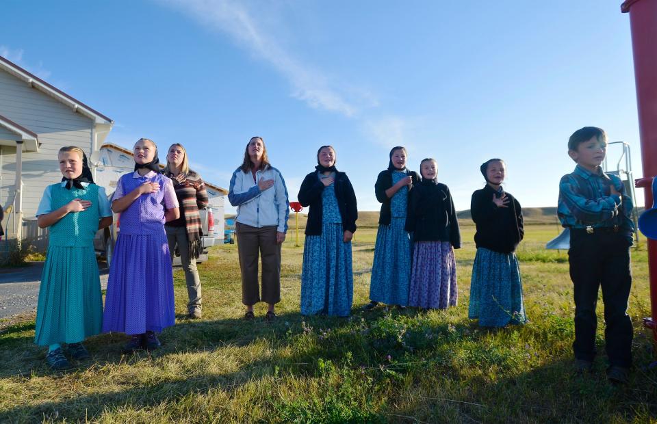 Traci Manseau, fourth from left, recites the Pledge of Allegiance with her students. Manseau is a teaching veteran of 23 years and she has spent her entire career teaching in one room rural school houses.