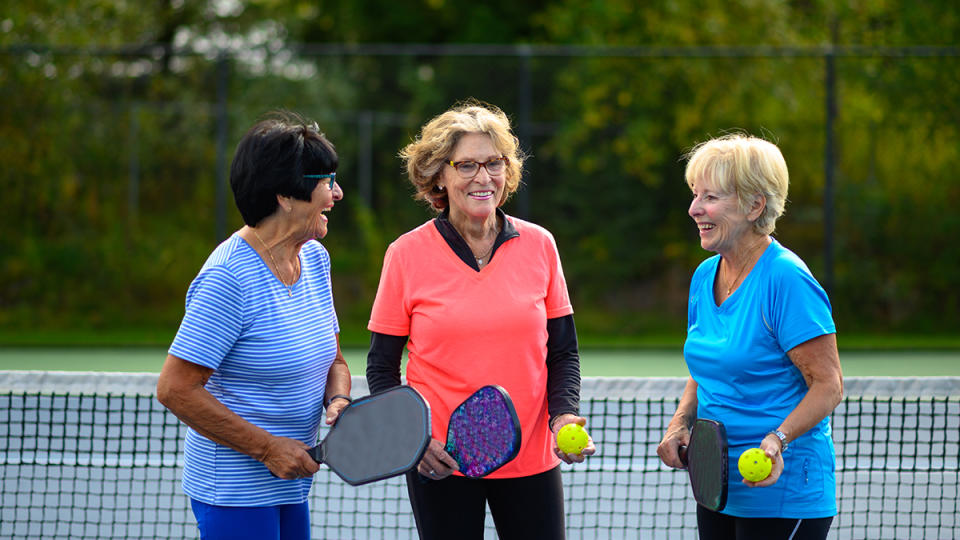 pickleball benefits: group of women playing pickleball