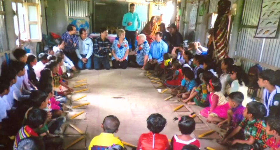 The kids sitting on the floor at the school in Bangladesh. 