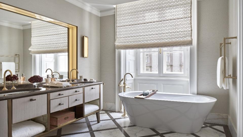 A bathroom in the Vienna hotel, featuring a stand-alone soaking tub. - Credit: Rosewood Hotels & Resorts