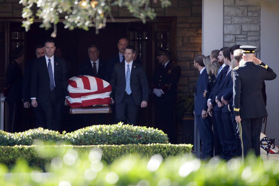 Members of the U.S. Secret Service carry the casket with former President George H. W. Bush to a hearse at George H. Lewis Funeral Home after a family service, Monday, Dec. 3, 2018, in Houston. Monday, Dec. 3, 2018, in Houston.