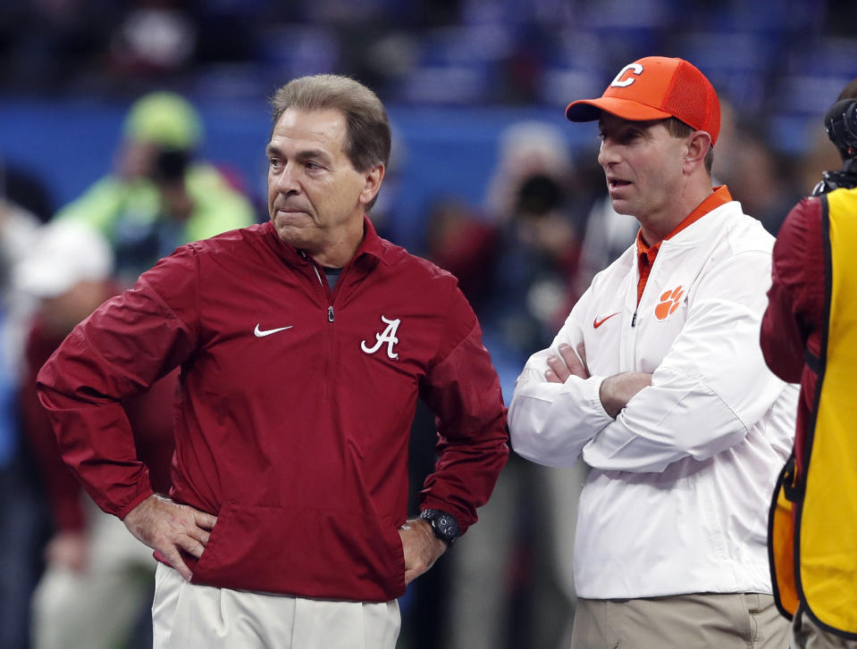 Alabama head coach Nick Saban, left, and Clemson head coach Dabo Swinney talk before the Sugar Bowl semi-final playoff game for the NCAA college football national championship, in New Orleans, Monday, Jan. 1, 2018. (AP Photo/Gerald Herbert)