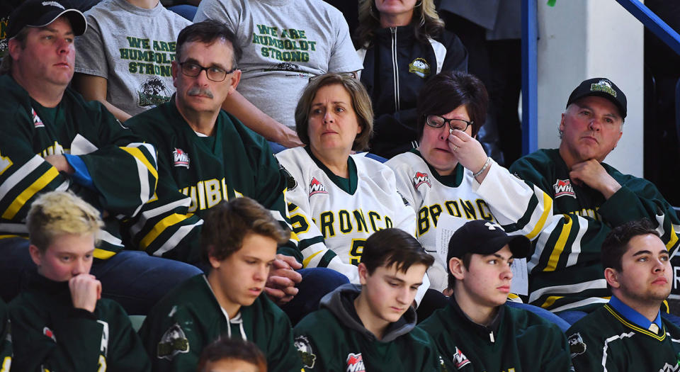 Mourners attend a vigil at the Elgar Petersen Arena, home of the Humboldt Broncos. (Jonathan Hayward/CP)