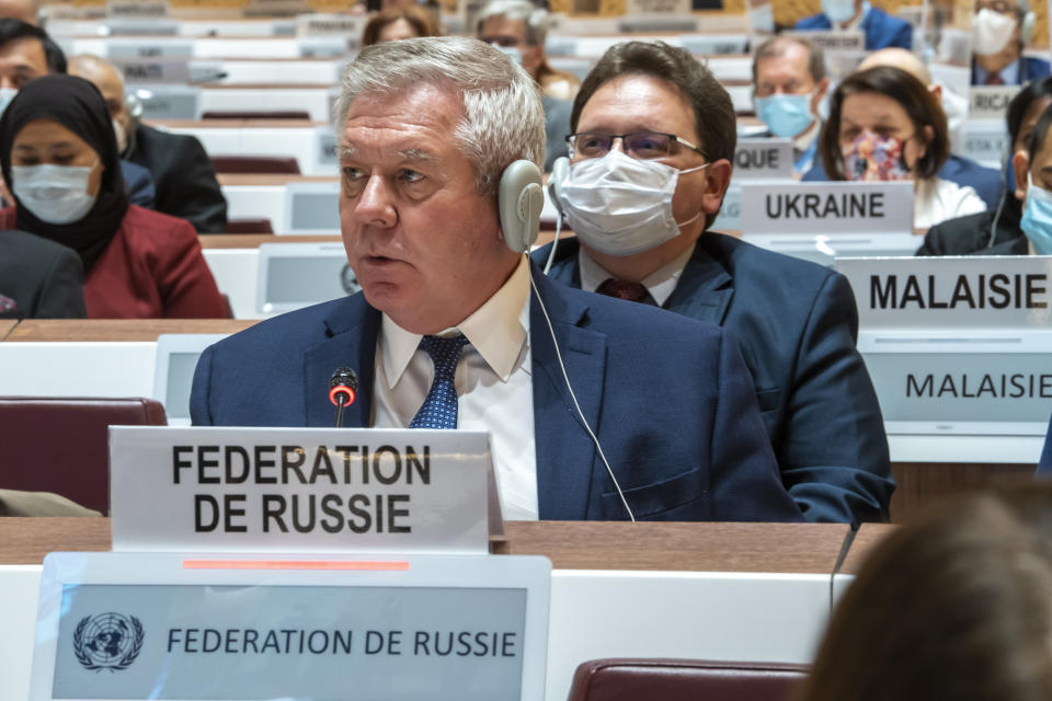 Russian ambassador Gennady Gatilov, left, and Ukraine's ambassador Yevheniia Filipenko, far right, listen to a speech, during the 49th session of the UN Human Rights Council about the Urgent Debate on the "situation of human rights in Ukraine stemming from the Russian aggression" at the European headquarters of the United Nations in Geneva, Switzerland, Thursday, March 3, 2022. (Martial Trezzini/Keystone via AP)