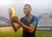 Soccer Football - World Cup - Final - France v Croatia - Luzhniki Stadium, Moscow, Russia - July 15, 2018 France's Kylian Mbappe celebrates with the trophy after winning the World Cup REUTERS/Kai Pfaffenbach