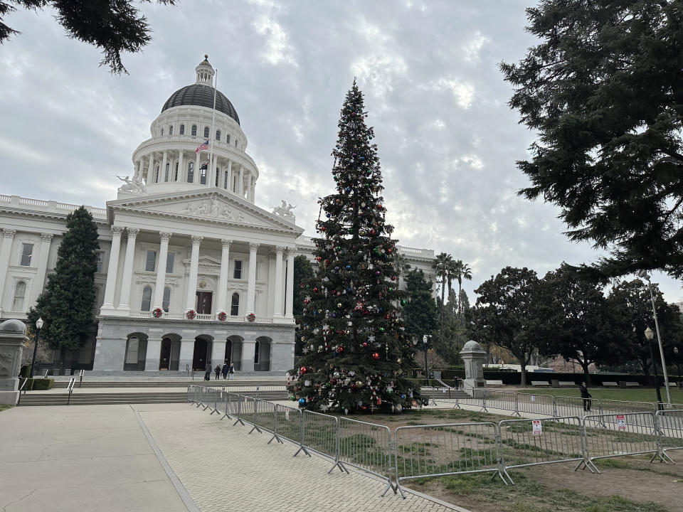 A Christmas tree stands in front of the west steps of the California Capitol on Wednesday, Dec. 6, 2023, in Sacramento, Calif. California will not have an in-person tree lighting ceremony this year. Instead, Gov. Gavin Newsom and his wife will host a pre-recorded ceremony that will be released Wednesday. Demonstrators calling for a cease-fire in Gaza have protested at the California Capitol and other public places. The Governor's Office said it was concerned about security. (AP Photo/Adam Beam)