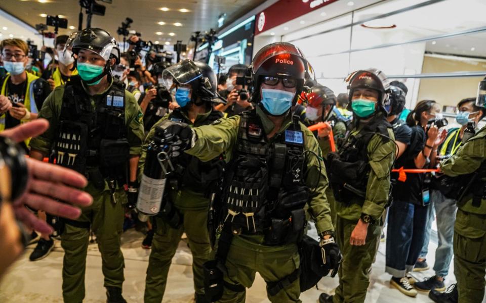 The police have become a symbol of eroding freedom in Hong Kong, using force to quell pro-democracy protests - Lam Yik /Bloomberg