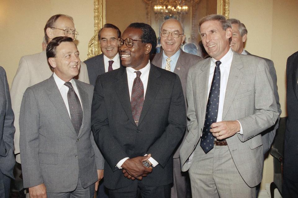 Supreme Court Justice nominee Clarence Thomas, center, poses with republican senators on Capitol Hill in Washington on Wednesday, July 25, 1991. With Thomas left to right are Sens. John Seymour, R-Calif., Larry Craig, R-Idaho, Robert Dole, R-Kan., Jesse Helms, R-N.C., Connie Mack, R-Fla., and Dan Coats, R-Ind., right front. (