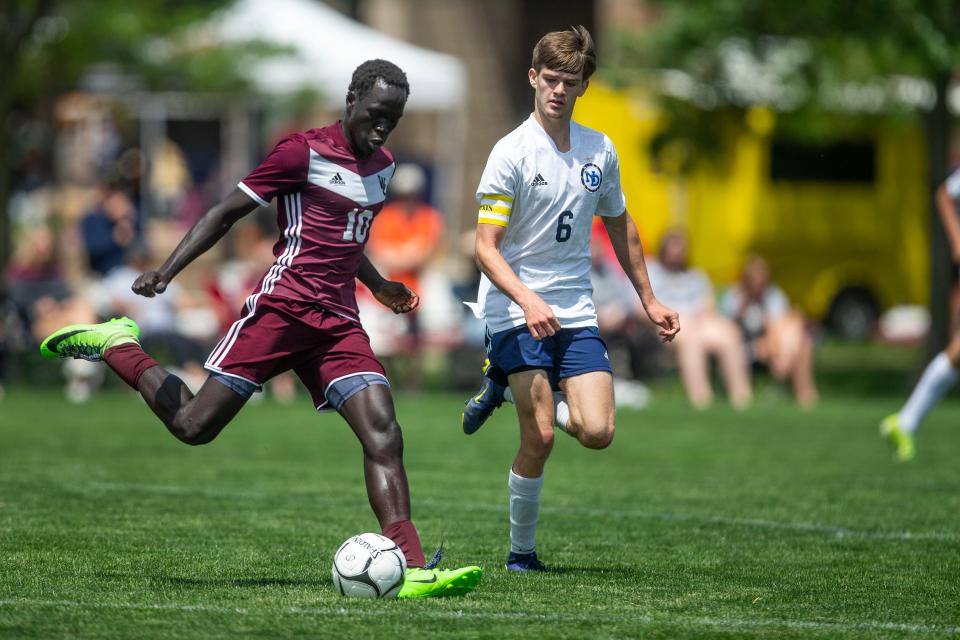 Western Christian's Uchan Harberts kicks the ball past Burlington Notre Dame's Hunter Lillie during the Class 1A quarterfinal in the Boys State Soccer Tournament between Burlington Notre Dame and Western Christian, on Wednesday, June 1, 2022, at the Cownie Soccer Complex, in Des Moines. 