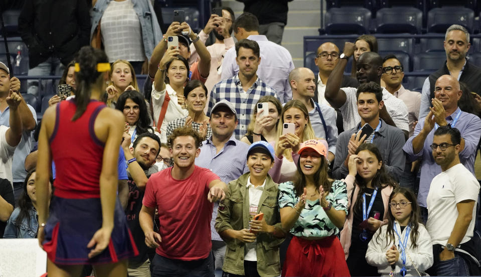 Tennis fans applaud Emma Raducanu, of Great Britain, after she defeated Maria Sakkari, of Greece, during the semifinals of the US Open tennis championships, Thursday, Sept. 9, 2021, in New York. (AP Photo/Elise Amendola)