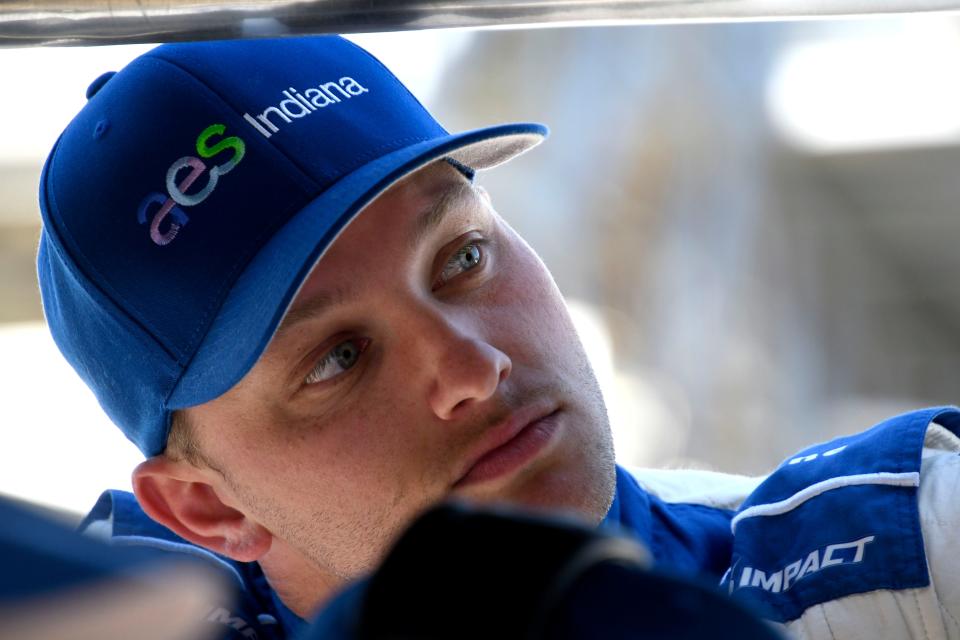 Dreyer & Reinbold Racing driver Sage Karam (24) stands in his pit box Tuesday, May 17, 2022, during the first day of Indianapolis 500 practice at Indianapolis Motor Speedway. 