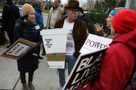 Protesters gather at Philadelphia police headquarters, a week after two black men were arrested at a Starbucks coffee shop, in Philadelphia, Pennsylvania, U.S. April 19, 2018. REUTERS/Dominick Reuter