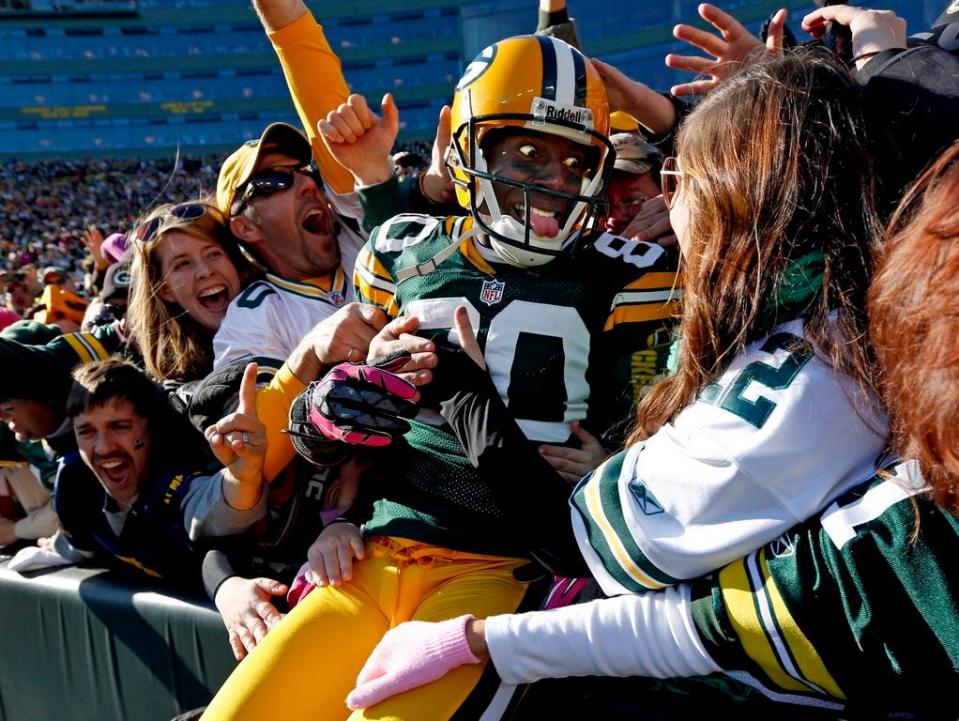 In this Oct. 28, 2012, file photo, Green Bay Packers wide receiver Donald Driver celebrates a touchdown after doing a Lambeau Leap during the second half of an NFL football game against the Jacksonville Jaguars, in Green Bay, Wisc.
