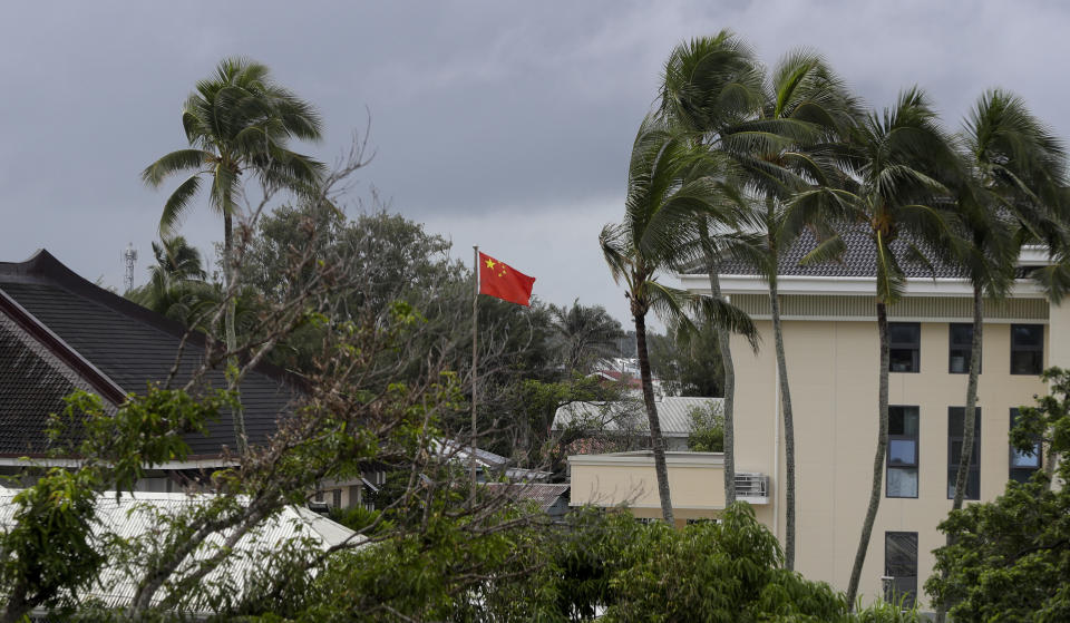 FILE - In this April 8, 2019, file photo, a Chinese flag flies outside the Chinese Embassy in Nuku'alofa, Tonga. The Sydney-based think tank Lowy Institute released its annual Pacific Aid Map, Wednesday, Sept. 29, 2021, saying China gave significantly less aid to the Pacific in recent years despite Beijing’s diplomatic efforts to increase its influence in the region. (AP Photo/Mark Baker, File)