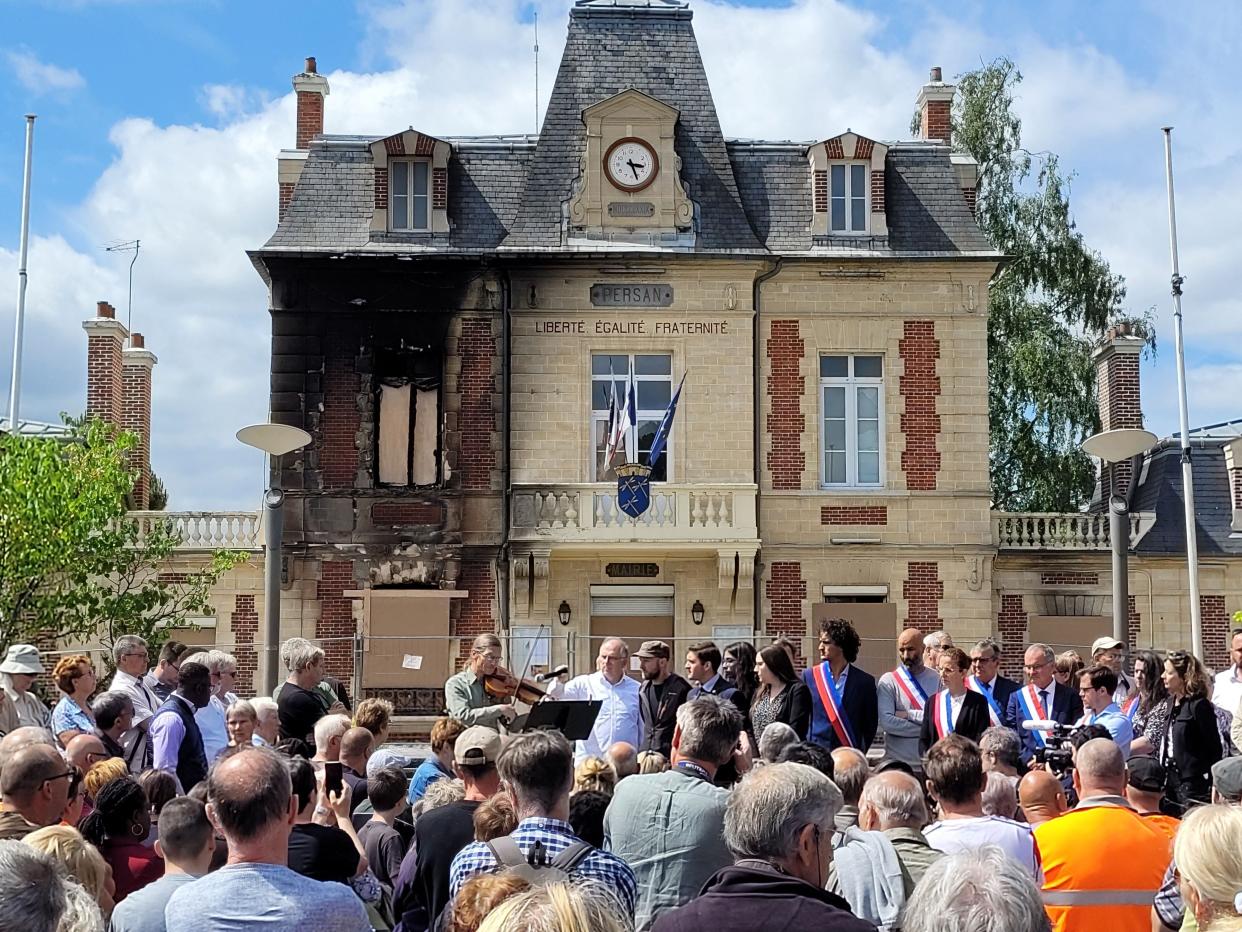 Local residents and representatives gather in front of the city hall during a nationwide action in Persan, on the outskirts of Paris, on 3 July 2023 (AFP via Getty Images)