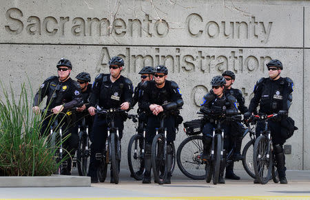 Bike-mounted police officers keep watch on protesters during a march downtown after the funeral of police shooting victim Stephon Clark, in Sacramento, California, U.S., March 29, 2018. REUTERS/Bob Strong